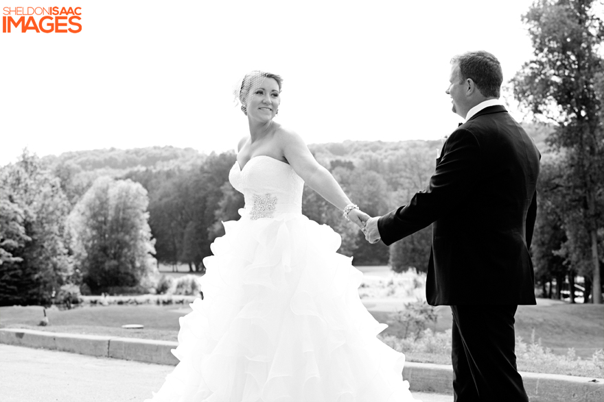 Bride and Groom Hold Hands Playfully