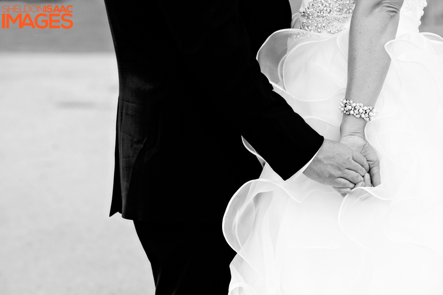 Bride and Groom Holding Hands