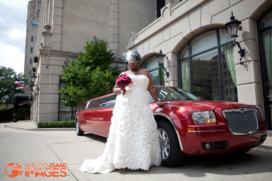 Stretch Limo parked near a Bride