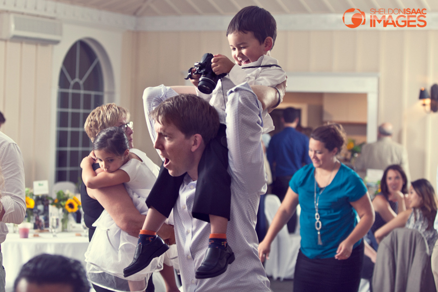 Child On Dads Shoulders Taking Pictures