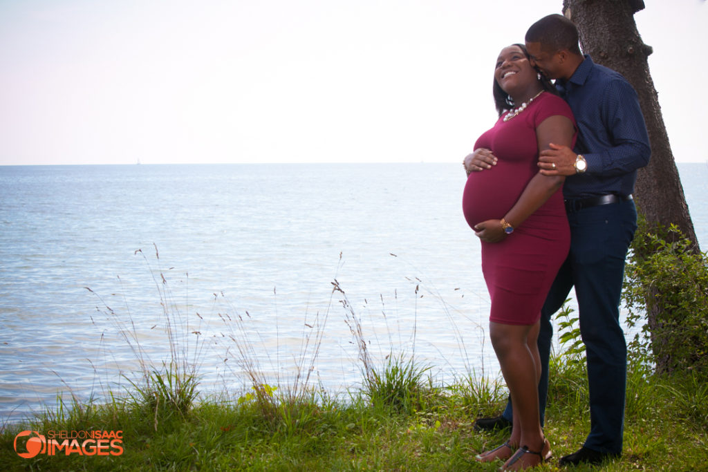 Pregnancy Photo Husband whispers to wife