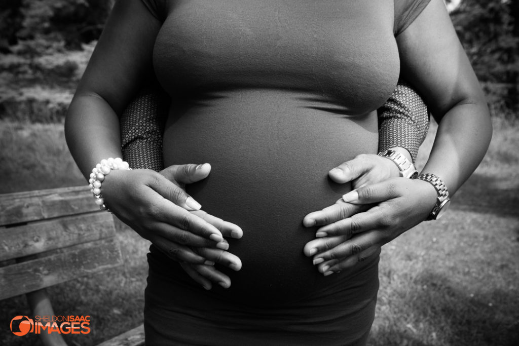 Maternity Photo husband and wifes touching baby bump