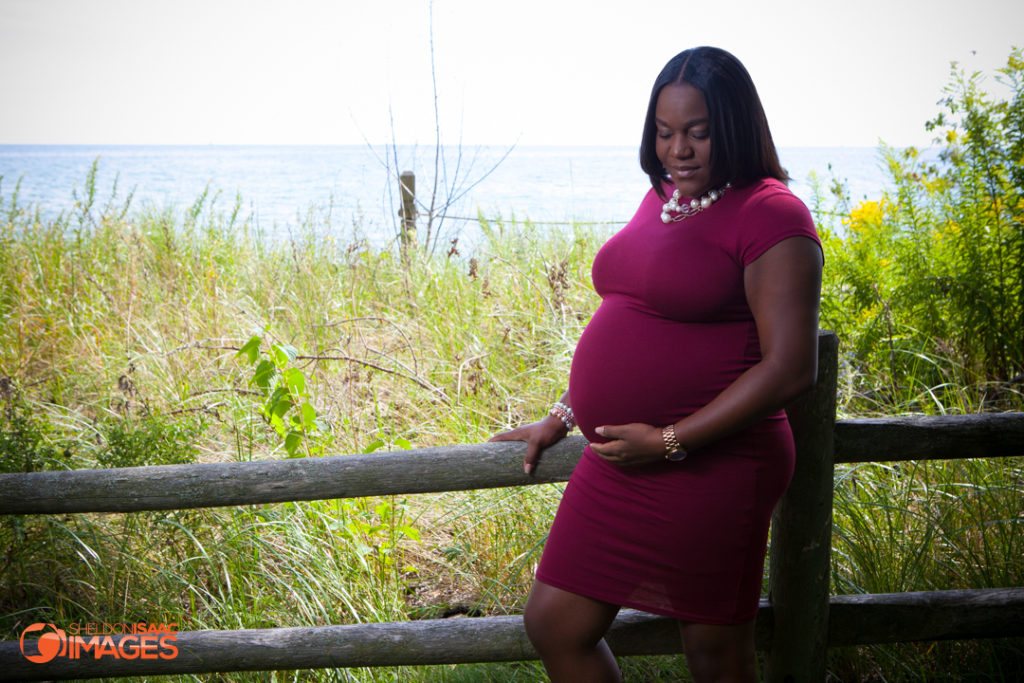 Maternity Photo pregnant lady looking at her baby bump