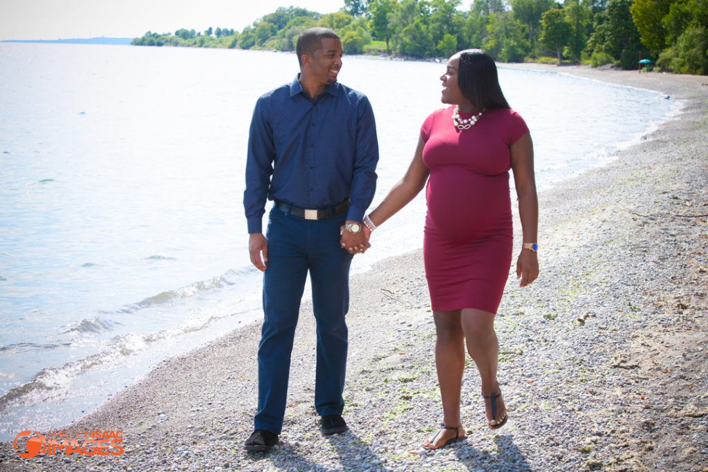 Maternity Photos couple walk at beach