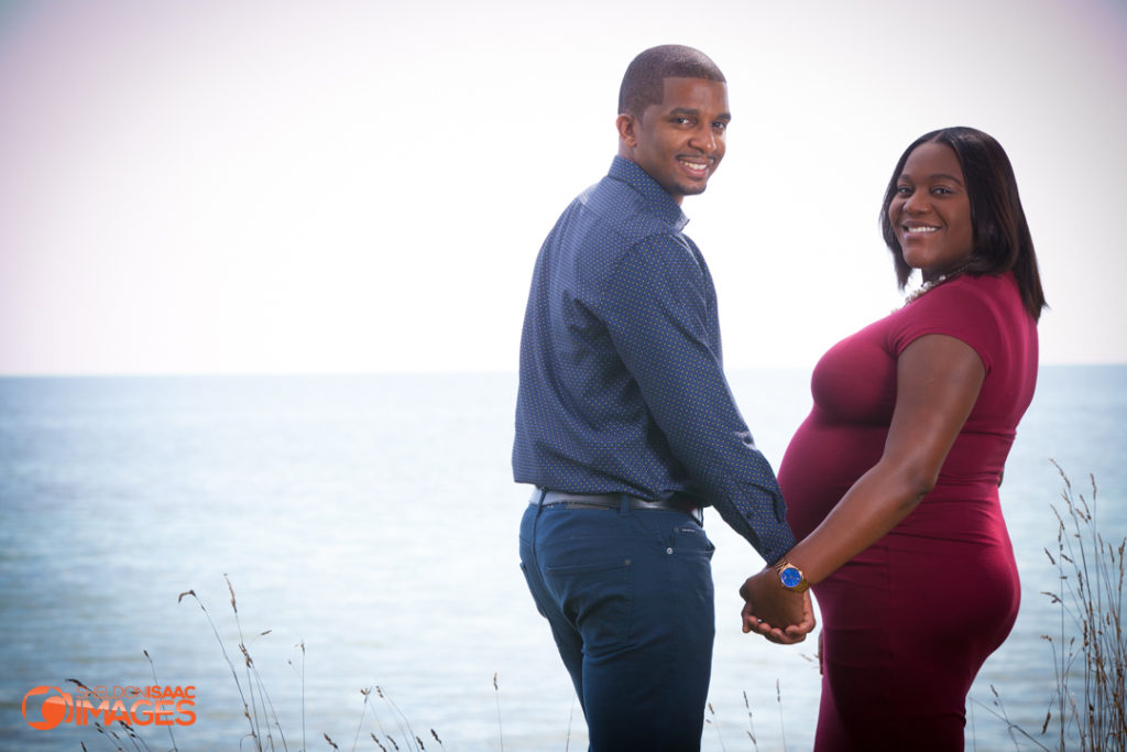 Maternity Photo couple looking at camera