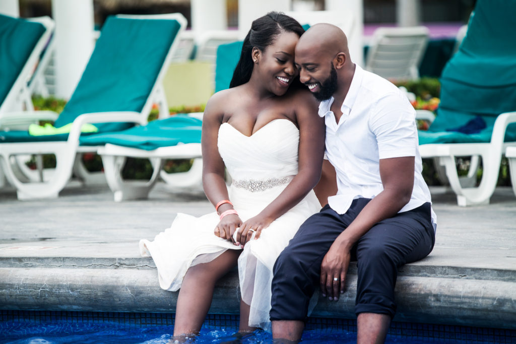 Bride and Groom sitting by the pool