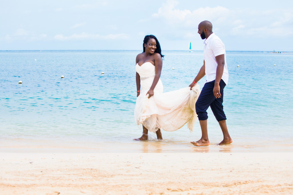 Bride and Groom laughing during Trash the Dress photoshoot in Montego Bay Jamaica