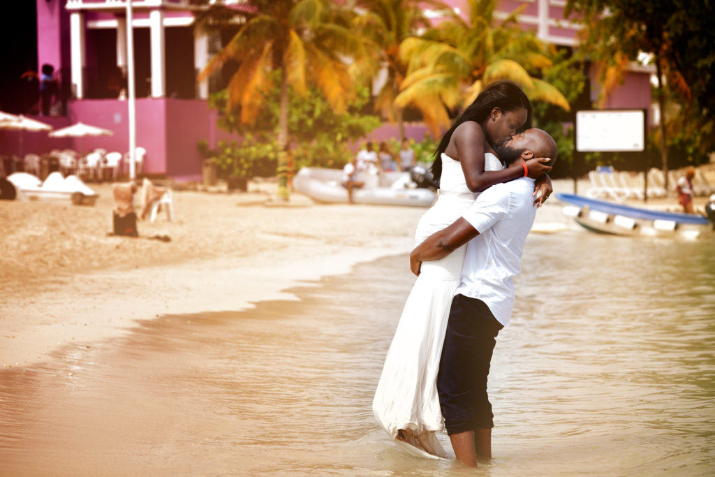 Bride and Groom kiss on the beach during Trash the dress in Montego Bay Jamaica