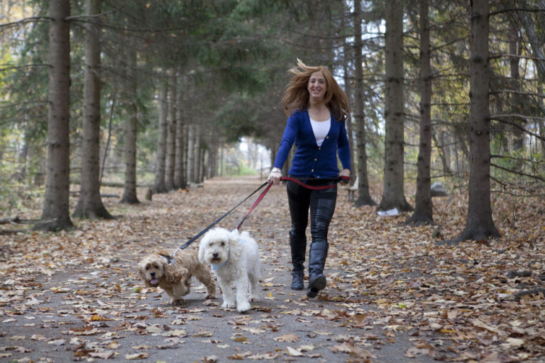 Portrait of lady walking her dogs at Sheppard's Bush Park in Aurora