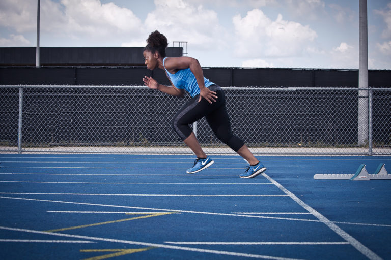 Track runner sprinting on the track in Brampton