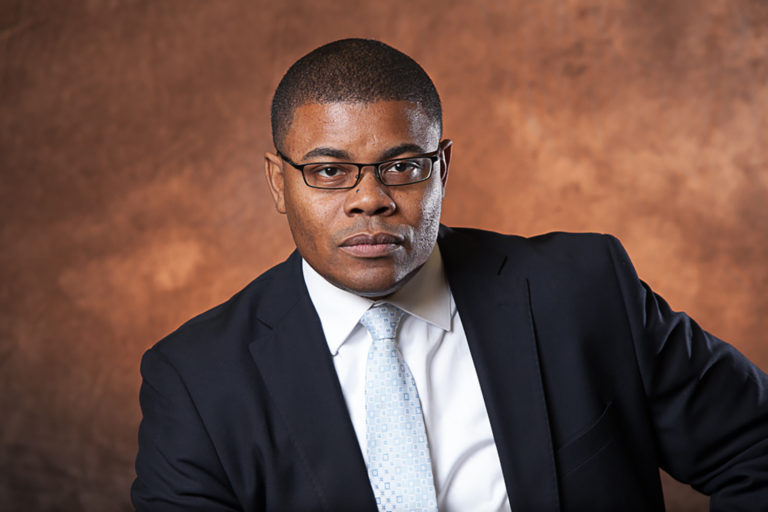 Man poses for his corporate headshot in Scarborough