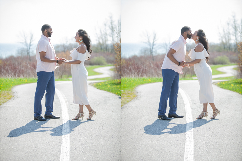 Engagement photo of a couple kissing at Lakeside Park in Ajax