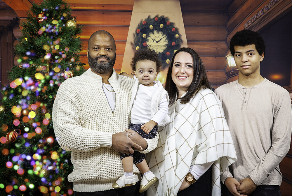 Family posing for Christmas portraits in Ajax