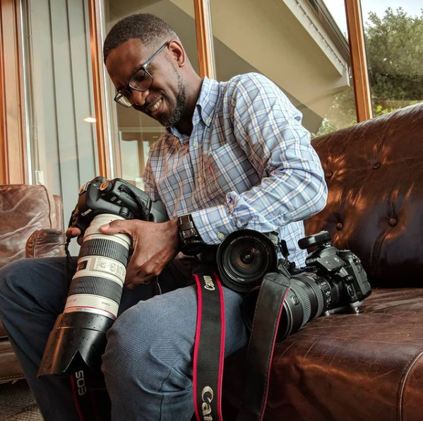 Photographer Sheldon Isaac with his cameras in Whitby