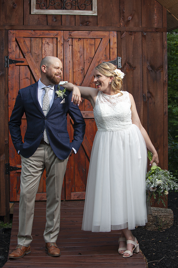 Groom and Bride look at each other at Millbrook Cathedral