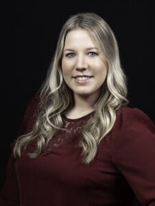 Lady smiles for her headshot photo in Whitby