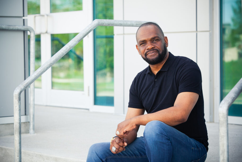 Pastor sitting on church steps for branding shoot