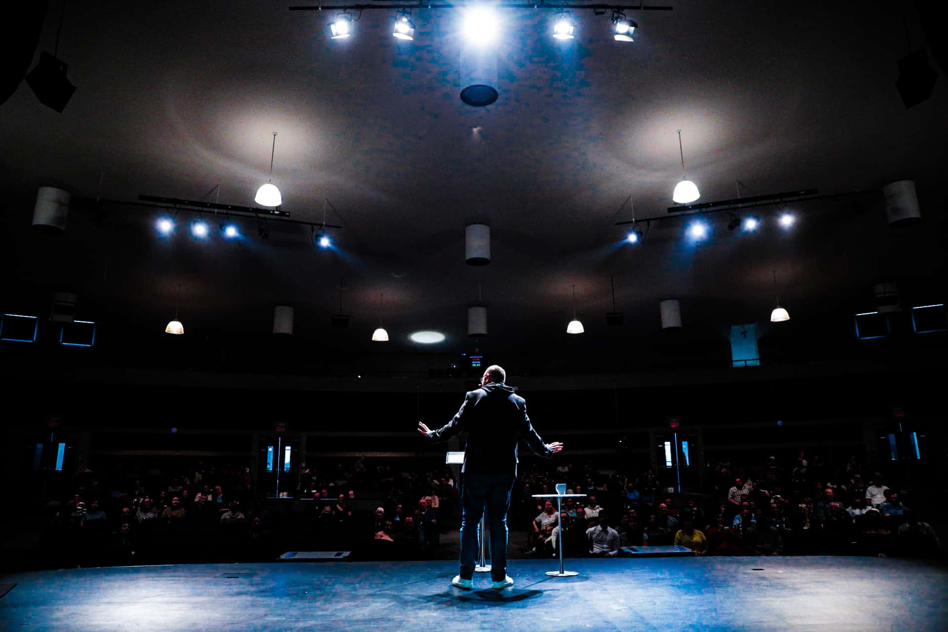 Pastor preaching to a large congregation at Sanctus Church in Ajax