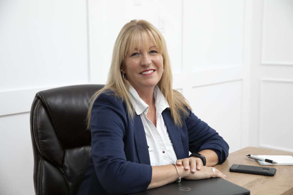 Woman entrepreneur smiles during branding photoshoot in Whitby