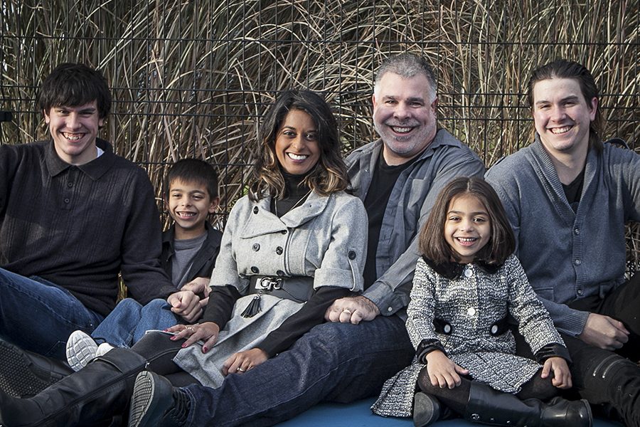 Family smiling at the Audley Recreation Centre in Ajax during their photoshoot