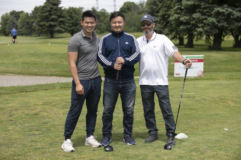 Golf tournament photographer Toronto - charity tournament with sponsor signage